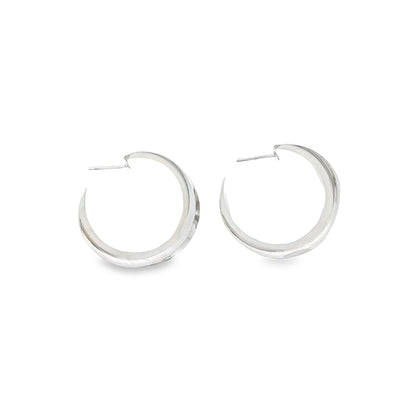 18K gold filled minimalist curved wide hoops by MIA Jewelry, showcasing smooth, polished gold hoops with a modern, curved design.