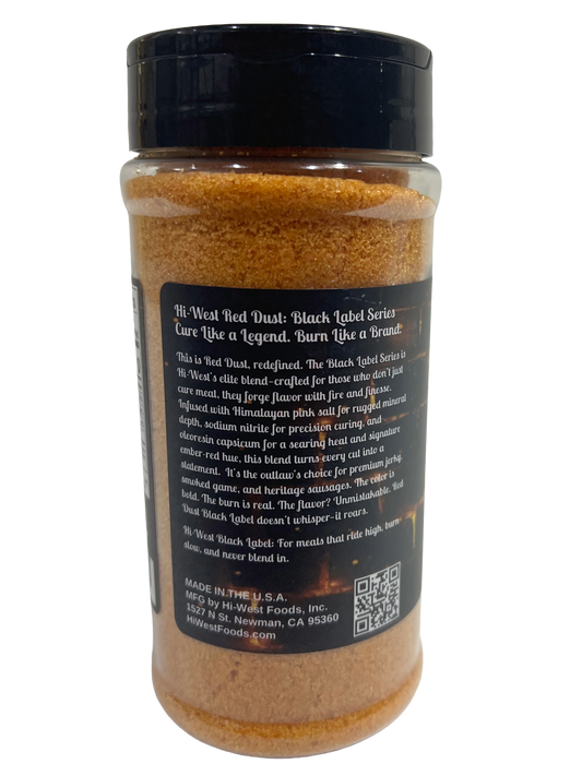 Hi-West Red Dust Black Label Curing Salt in a clear container, showcasing its vibrant red color for curing meats.