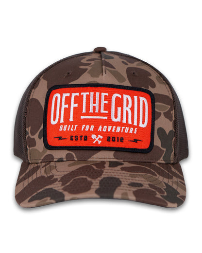 Off The Grid Surplus Ranch Hand Hat in Bark Duck Camo with brown fabric, featuring a wide brim and rugged outdoor style.