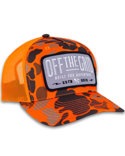 Off The Grid Surplus Ranch Hand hat in blaze duck camo with wide brim and adjustable strap, designed for outdoor wear.