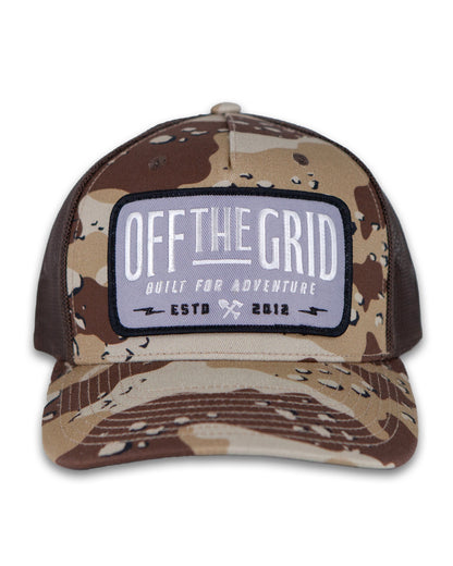 Off The Grid Surplus Ranch Hand Hat in desert camo with brown tones, featuring a wide brim and sturdy construction.