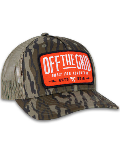 Off The Grid Surplus Ranch Hand Hat in Mossy Oak camouflage, featuring a sturdy brim and classic outdoor hat design.