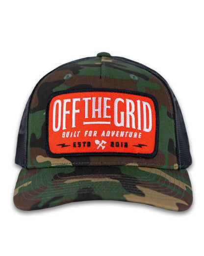 Off The Grid Surplus Ranch Hand Hat in woodland camo with a wide brim, designed for outdoor wear and sun protection.