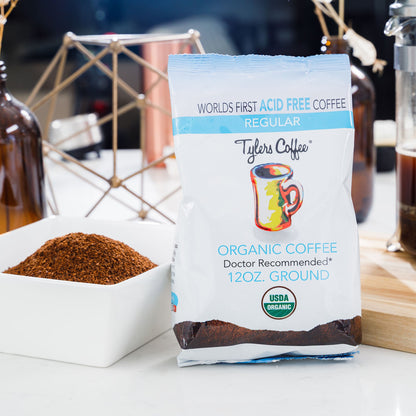 Bag of Tylers Coffees regular acid-free ground coffee in a 12oz bag, showing the coffee grounds and packaging.