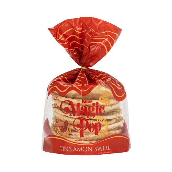 Kim's Magic Pop cinnamon swirl flavor drizzled snack, close-up of crispy popcorn with cinnamon and caramel drizzle.