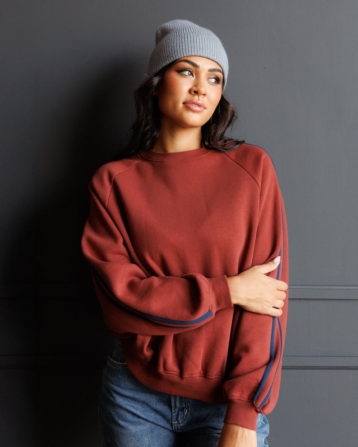 Downeast Retro Stripe Crew top with colorful horizontal stripes, long sleeves, and a classic crew neckline.