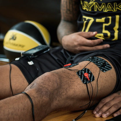 iReliev SPORT TENS + EMS muscle stimulator device with electrodes, designed for pain relief and muscle recovery.