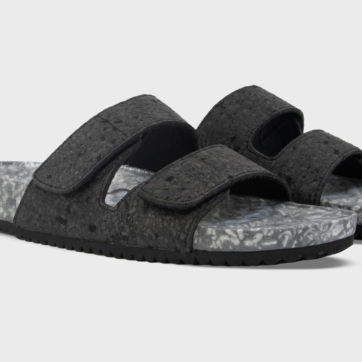 Pair of Fleks Riviera Sandals in Nightfall color with adjustable straps and cushioned soles, displayed on a white background.