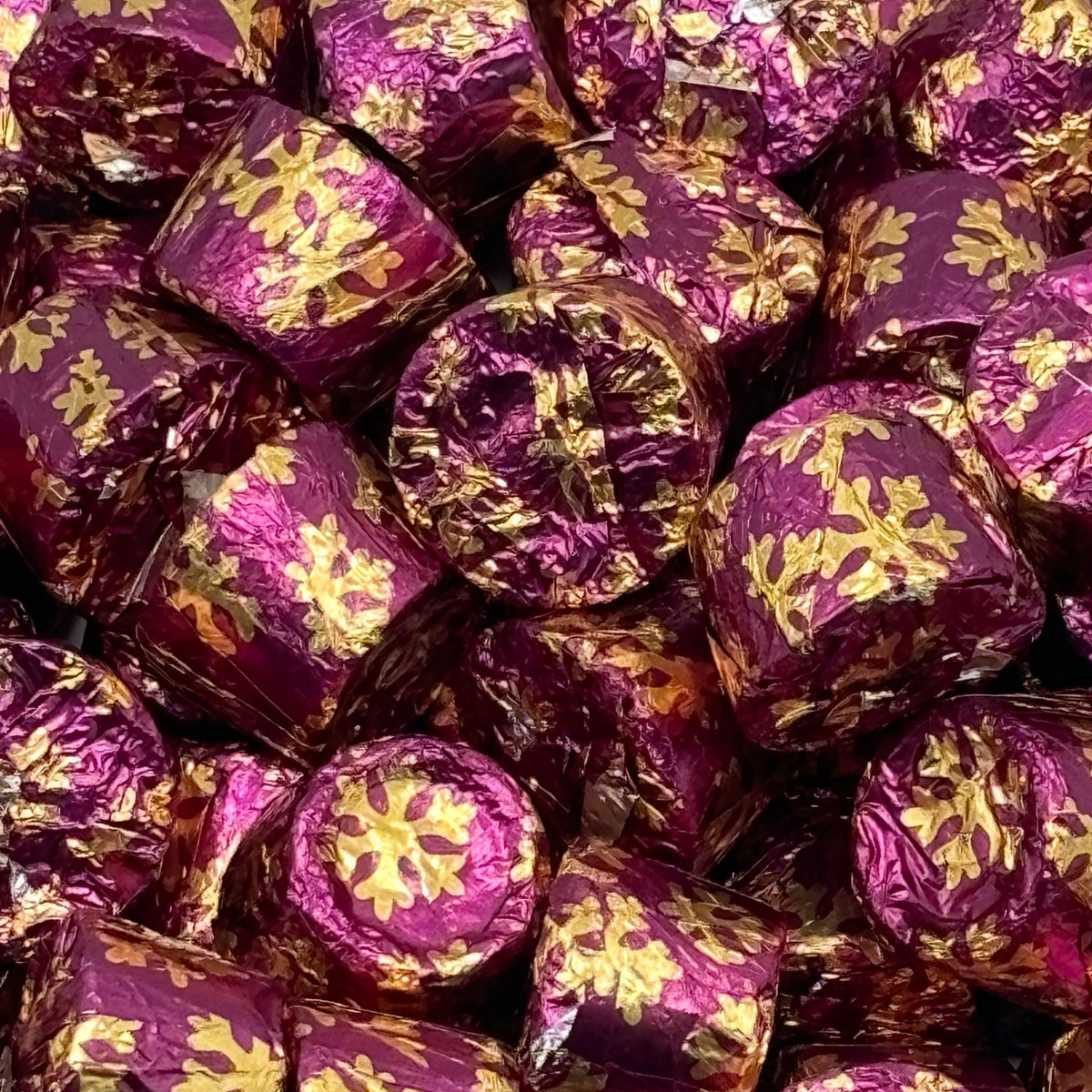 Rolo salted caramel dark chocolate candies wrapped in Christmas foil, bulk value bag from Candy In Bulk.