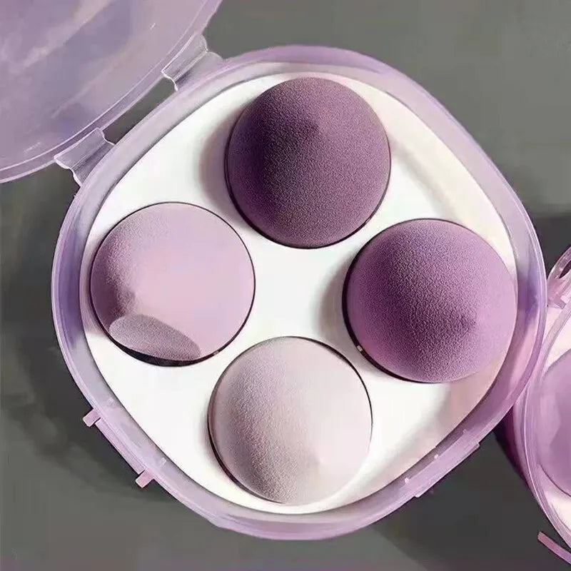 Set of four Blushimmer beauty egg makeup sponges with egg box for foundation, cream, and powder application on a white background.
