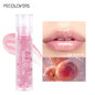 Transparent glass lip gloss by Blushimmer featuring mirror-like finish, moisturizing crystal jelly formula, and plumping lip care.