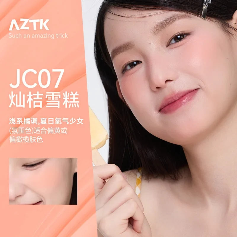 Blushimmer AZTK liquid blush in JC04 shade, featuring a sleek container with a soft pink color and smooth liquid texture.