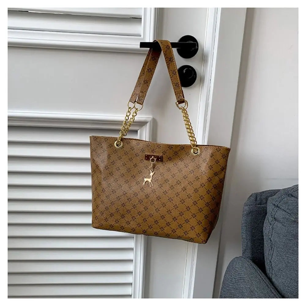 Women luxury tote bag with large capacity, printed design, shoulder strap, trendy handbag for shopping and everyday use.
