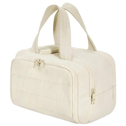 Large waterproof Blushimmer cosmetic bag with multiple compartments, designed for travel, toiletries, and makeup organization.