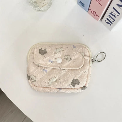 Cute cartoon small Blushimmer travel cosmetic bag with lipstick, earphone, and card storage compartments for women.