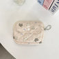 Cute cartoon small Blushimmer travel cosmetic bag with lipstick, earphone, and card storage compartments for women.
