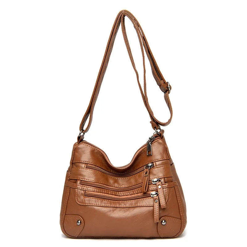 OBA women's multi-layer leather shoulder crossbody bag in yellowish brown, stylish handbag with multiple compartments and adjustable strap.