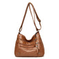 OBA women's multi-layer leather shoulder crossbody bag in yellowish brown, stylish handbag with multiple compartments and adjustable strap.