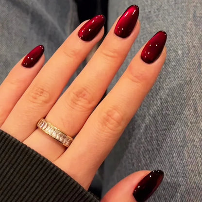 Set of 24 glossy red cat's eye press on nails by Blushimmer, nude almond shape, full cover false nails, detachable and wearable.