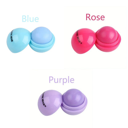 Blushimmer cute ball-shaped lip balm in pink with non-stick cup for hydrating, soothing, long-lasting lip plumping.