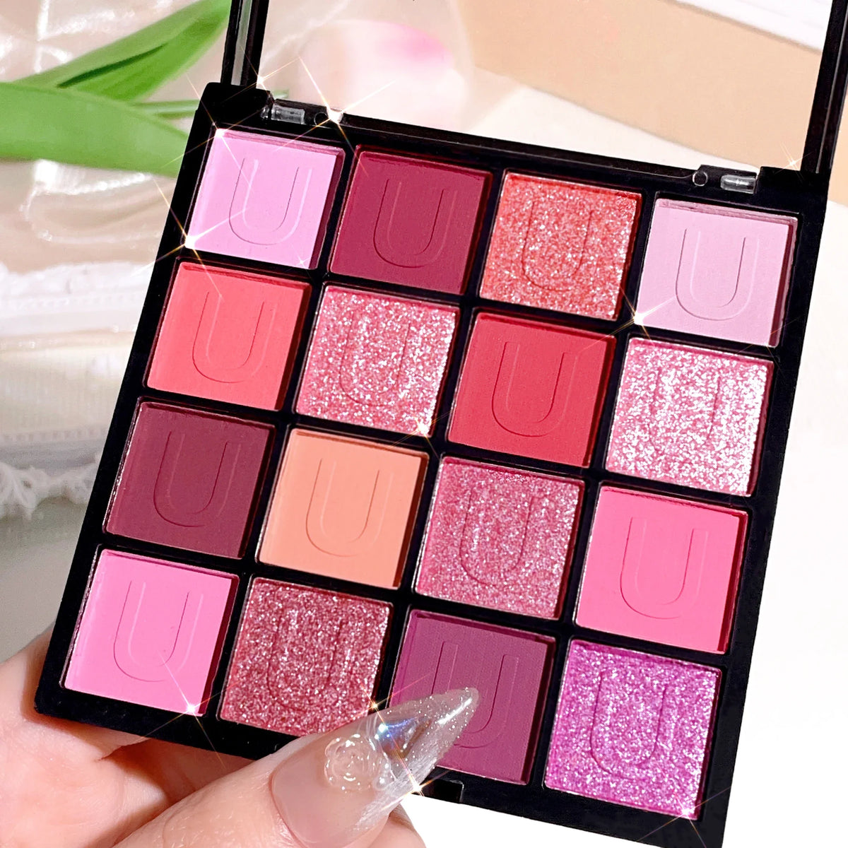 Blushimmer 16-grid red eyeshadow tray with purple glitter, pearl, and matte shades for shimmering Korean eye makeup looks