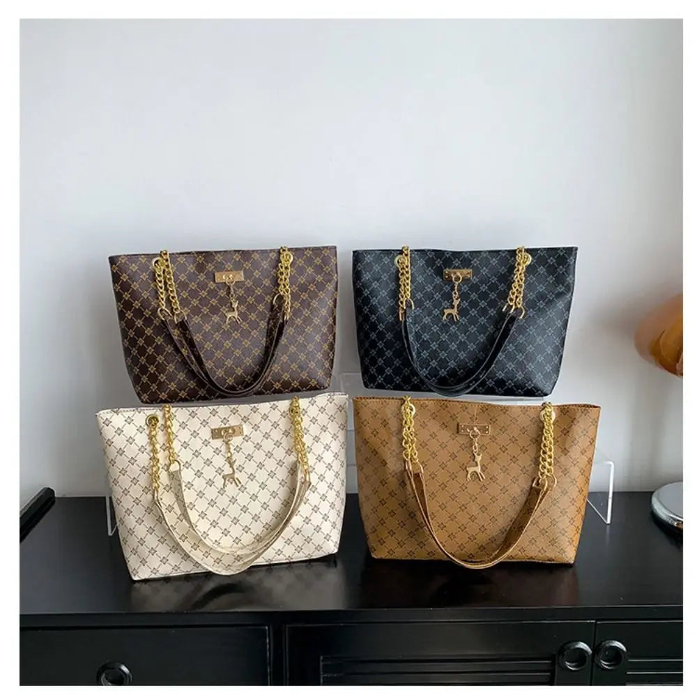 Women luxury tote bag with large capacity, printed design, shoulder strap, trendy handbag for shopping and everyday use.