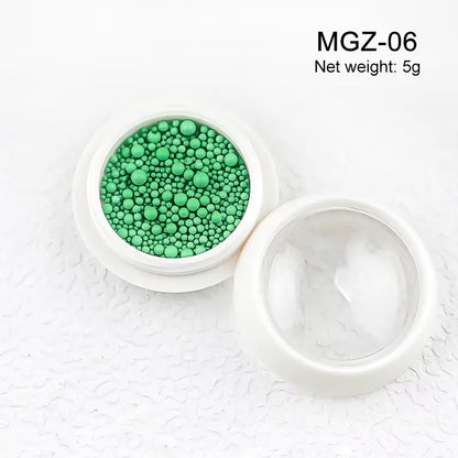 White acrylic flower nail art decorations with mixed size red and blue rhinestones for DIY manicure, from Blushimmer.