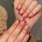 Red heart-shaped false nail set with 24 pieces and a cuticle pusher from Blushimmer, featuring detachable design for easy application.