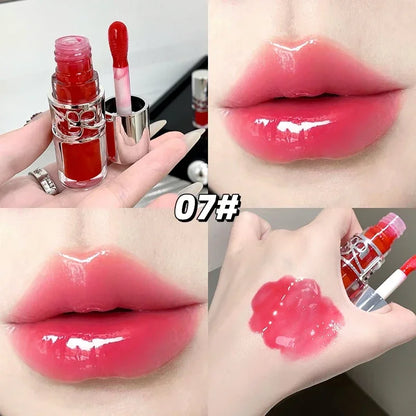 Clear glass tube of Blushimmer Shine Lip Gloss with watery, moisturizing formula and juicy, long-lasting lip tint and plumper.