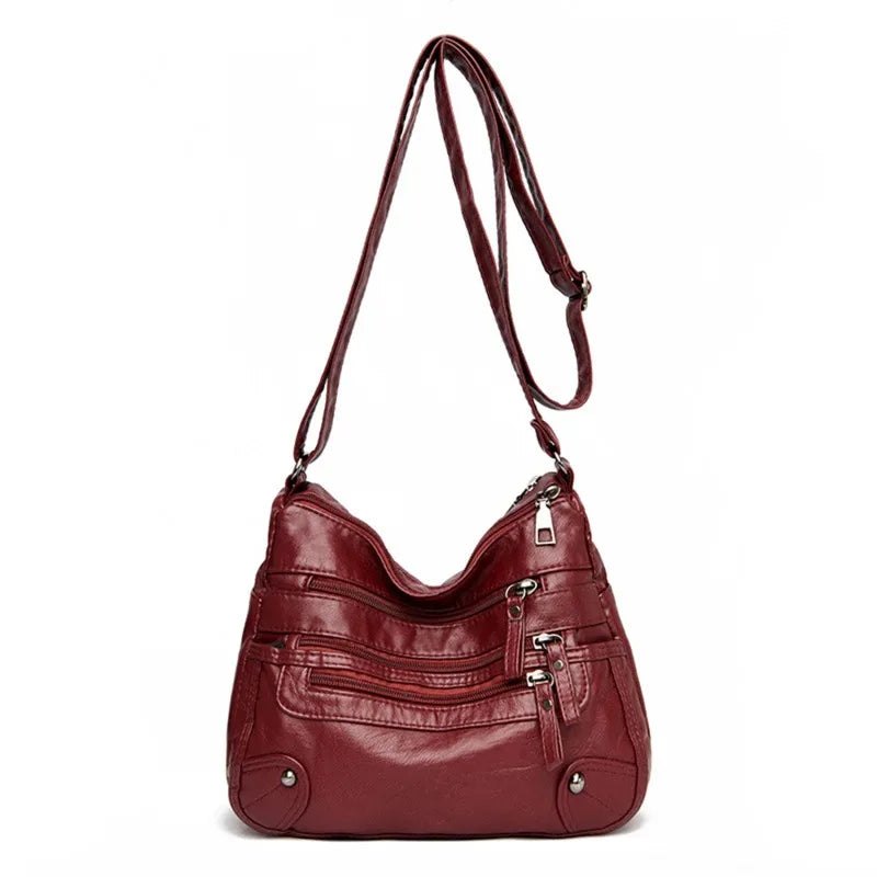 OBA women's multi-layer red leather shoulder crossbody bag with multiple compartments and adjustable strap.