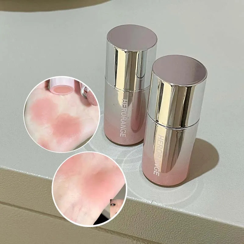 Blushimmer HERORANGE liquid blush in a natural, low-saturation matte shade, showing the product bottle and swatch on skin