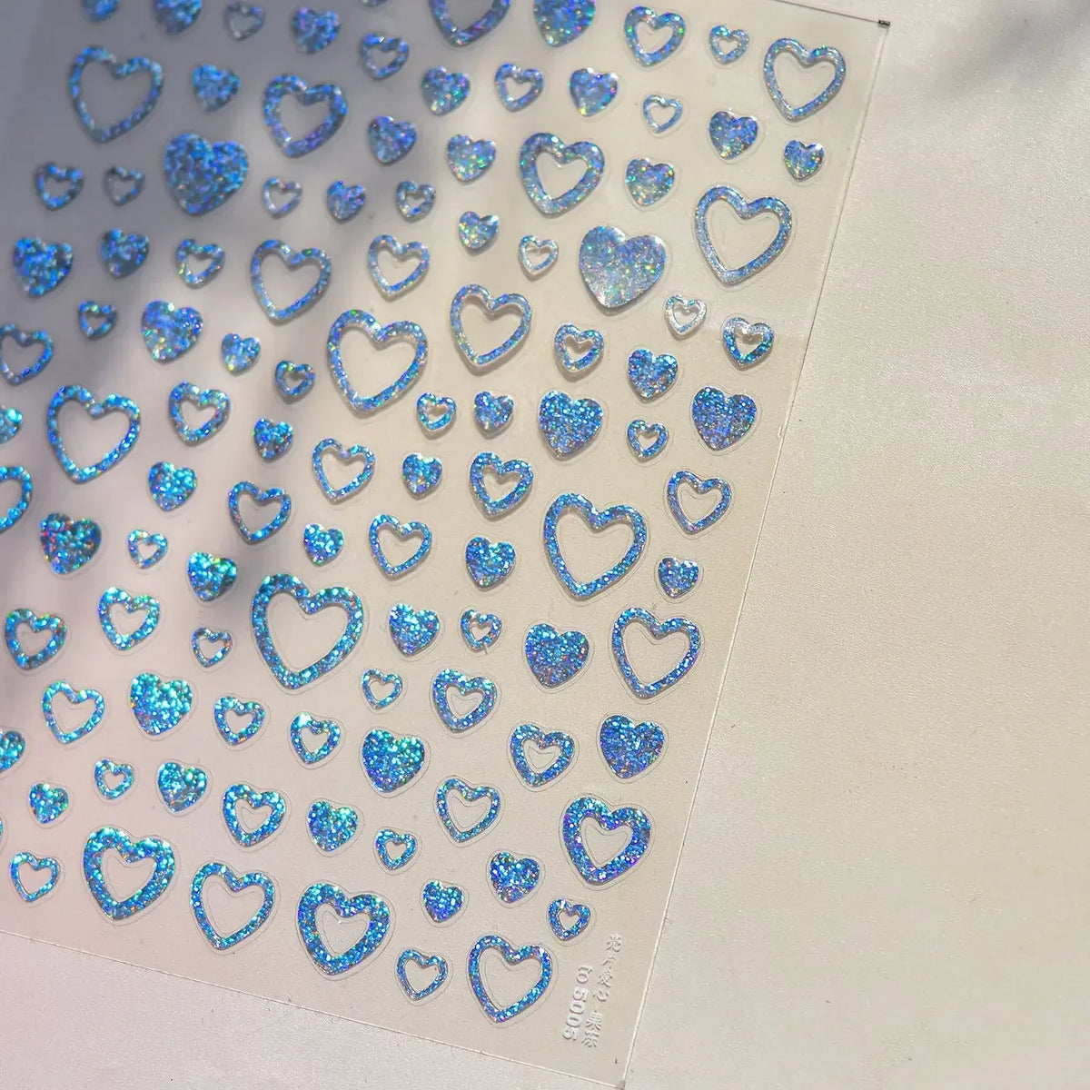 Colorful Cat's Eye 5D gradient European love heart gem nail art stickers with geometric wing designs for manicure decoration.