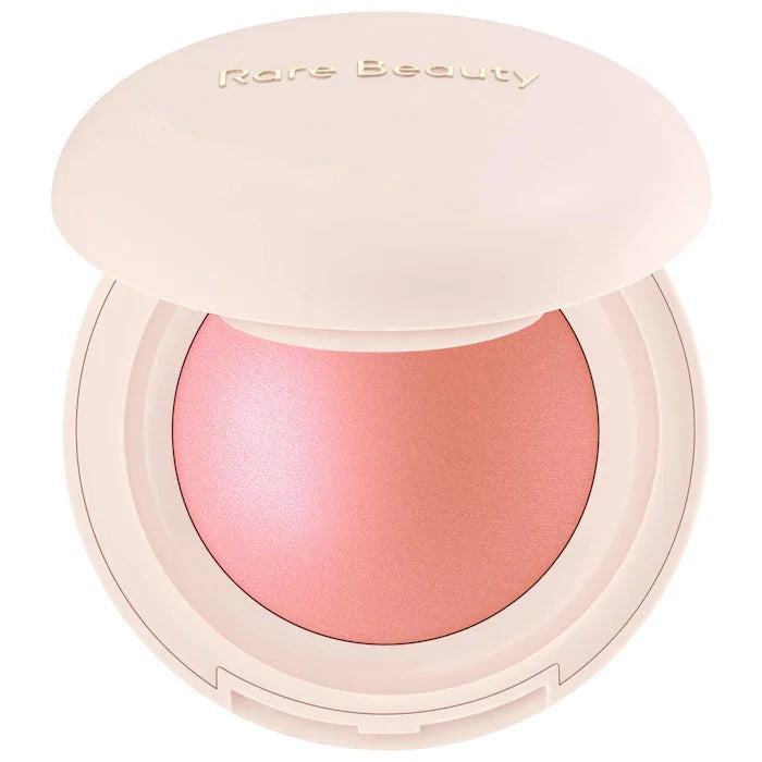 Blushimmer Rare Beauty Positive Light liquid contour, luminizer, blush, and face shimmer in a sleek makeup bottle.