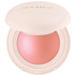 Blushimmer Rare Beauty Positive Light liquid contour, luminizer, blush, and face shimmer in a sleek makeup bottle.