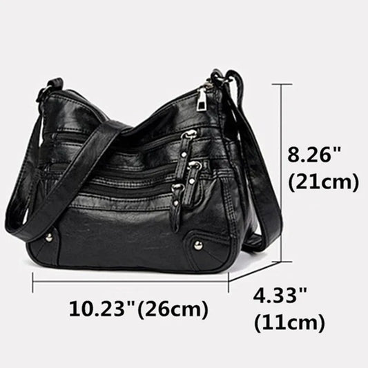 OBA women's black multi-layer leather shoulder crossbody bag with multiple compartments and adjustable strap.