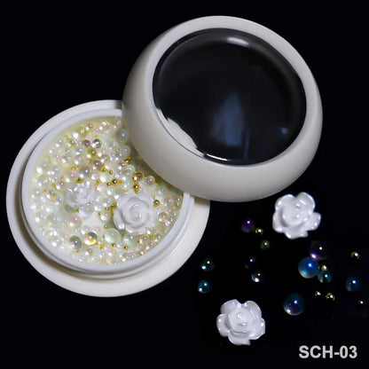 White acrylic flower nail art decorations with mixed size rhinestones, red and blue gems, for DIY manicure accessories.