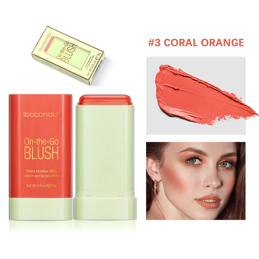 Blushimmer makeup blush stick in bright coral, waterproof cream formula with high color payoff on smooth skin.