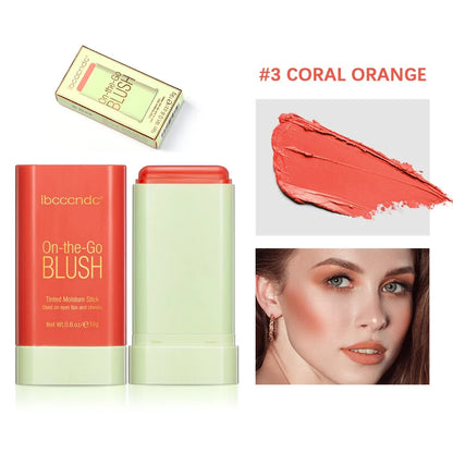 Blushimmer makeup blush stick in bright coral, waterproof cream formula with high color payoff on smooth skin.
