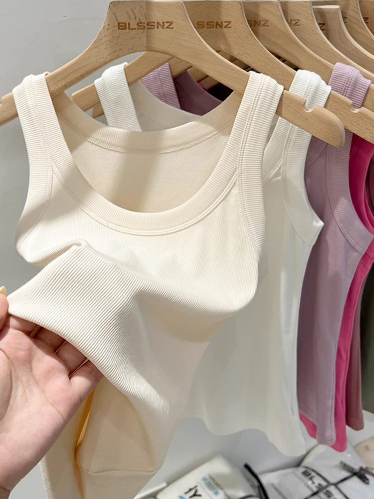 Zjaiss women's solid ribbed round neck tank top in beige, lightweight and elastic for summer wear, close-up of fabric and neckline.