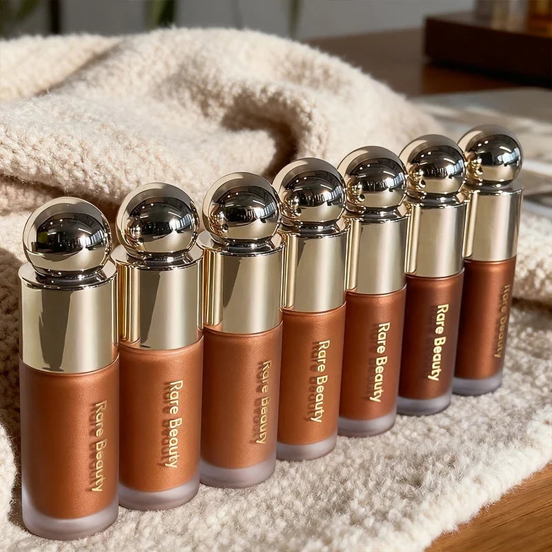 Blushimmer Rare Beauty bronzer stick with creamy, blendable formula for natural sun-kissed face contour and sculpting makeup.