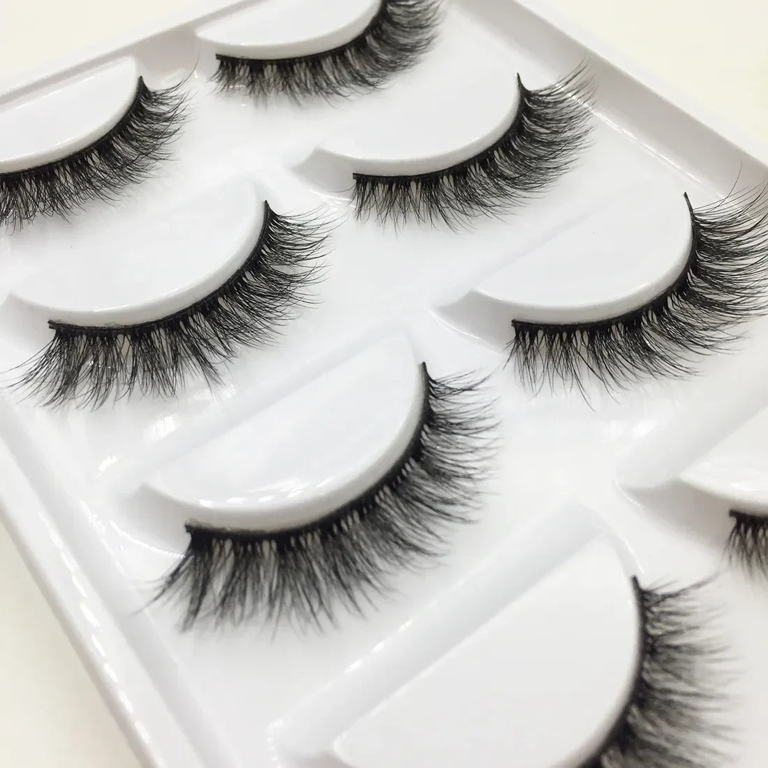 Set of 5 pairs of Blushimmer 3D mink false eyelashes with natural, voluminous design for makeup and beauty enhancement.