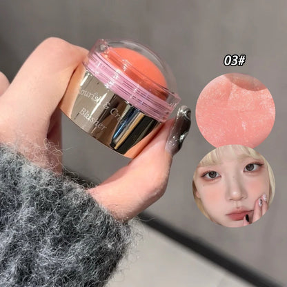 Blushimmer purple creamy blush stick with peach pink tint, soft face blusher for brightening and contouring cheeks.