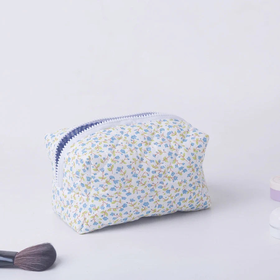 Large floral quilted makeup organizer by Blushimmer featuring a flower print and spacious design for travel and cosmetic storage.