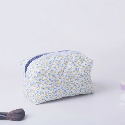 Large floral quilted makeup organizer by Blushimmer featuring a flower print and spacious design for travel and cosmetic storage.