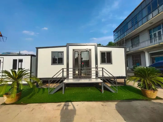 Expandable BACKUPMYFILESNOW® modular container house with 2 bedrooms, foldable design, shown in a modern outdoor setting.