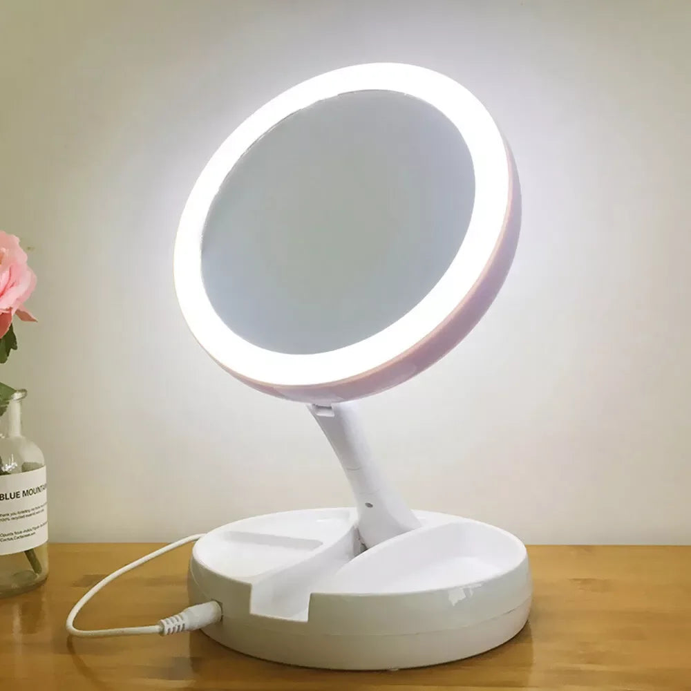 Blushimmer portable double-sided LED makeup mirror with USB/ dry battery power and 10x magnification, ideal for detailed makeup application.