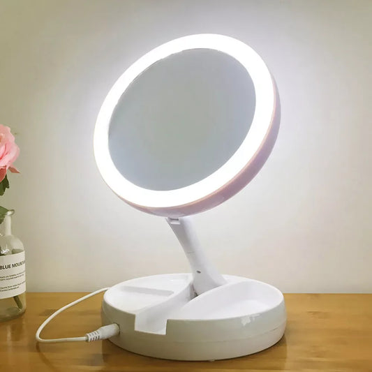 Blushimmer portable double-sided LED makeup mirror with USB/ dry battery power and 10x magnification, ideal for detailed makeup application.