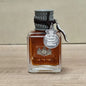 Blushimmer Charm Unleashed men's cologne bottle featuring woody, citrus, and vitality notes, with a wild, glamorous scent.