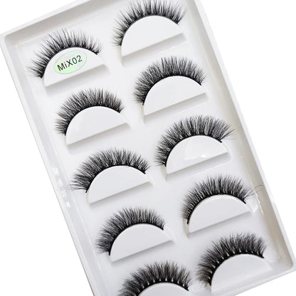 Five pairs of natural 3D mink false eyelashes by Blushimmer, featuring full lash bands and a flared cat-eye style for makeup.