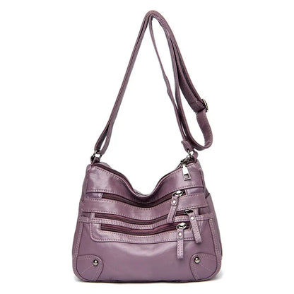 Purple women's multi-layer leather shoulder crossbody bag by OBA, featuring multiple compartments and stylish design.